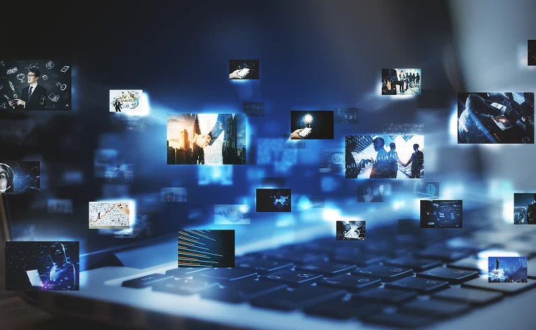laptop displaying technological images in blue lig