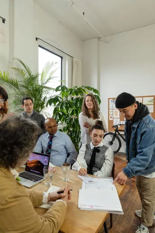 Startup team discussing ideas around a table