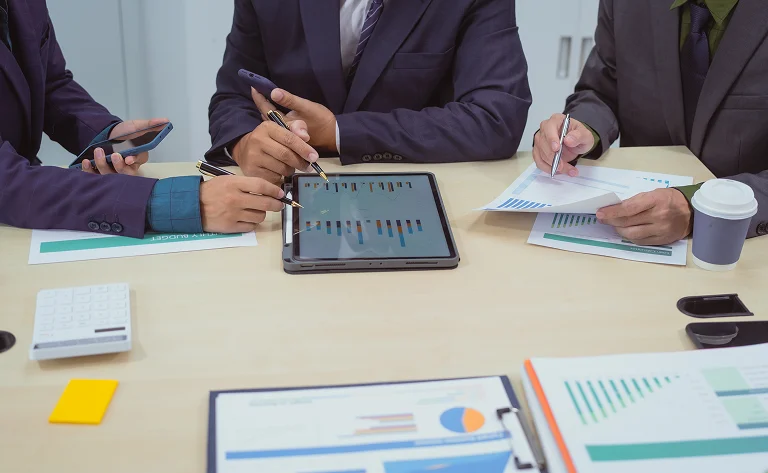business meeting analyzing data in an office setting