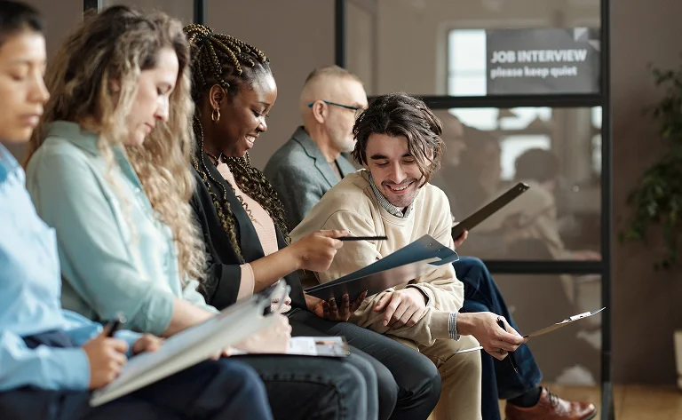 hopeful people waiting with paperwork for job