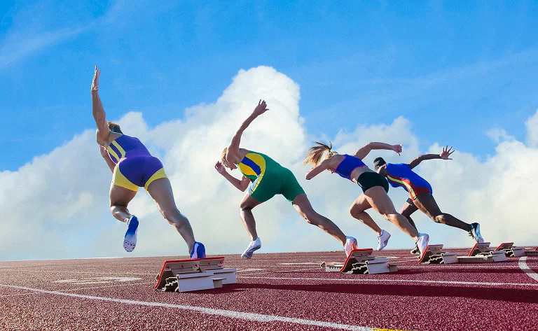 track runners starting race on a sunny day